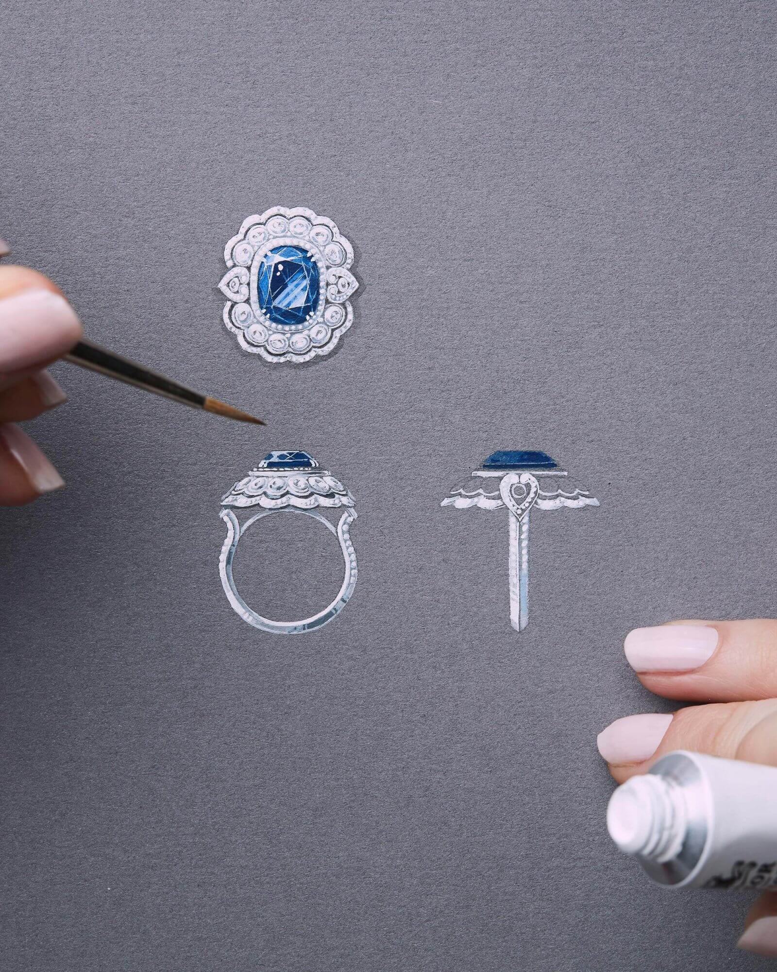 a Garrard jewellery designer skethcing a bespoke sapphire Garrard engagement ring on gouache paper