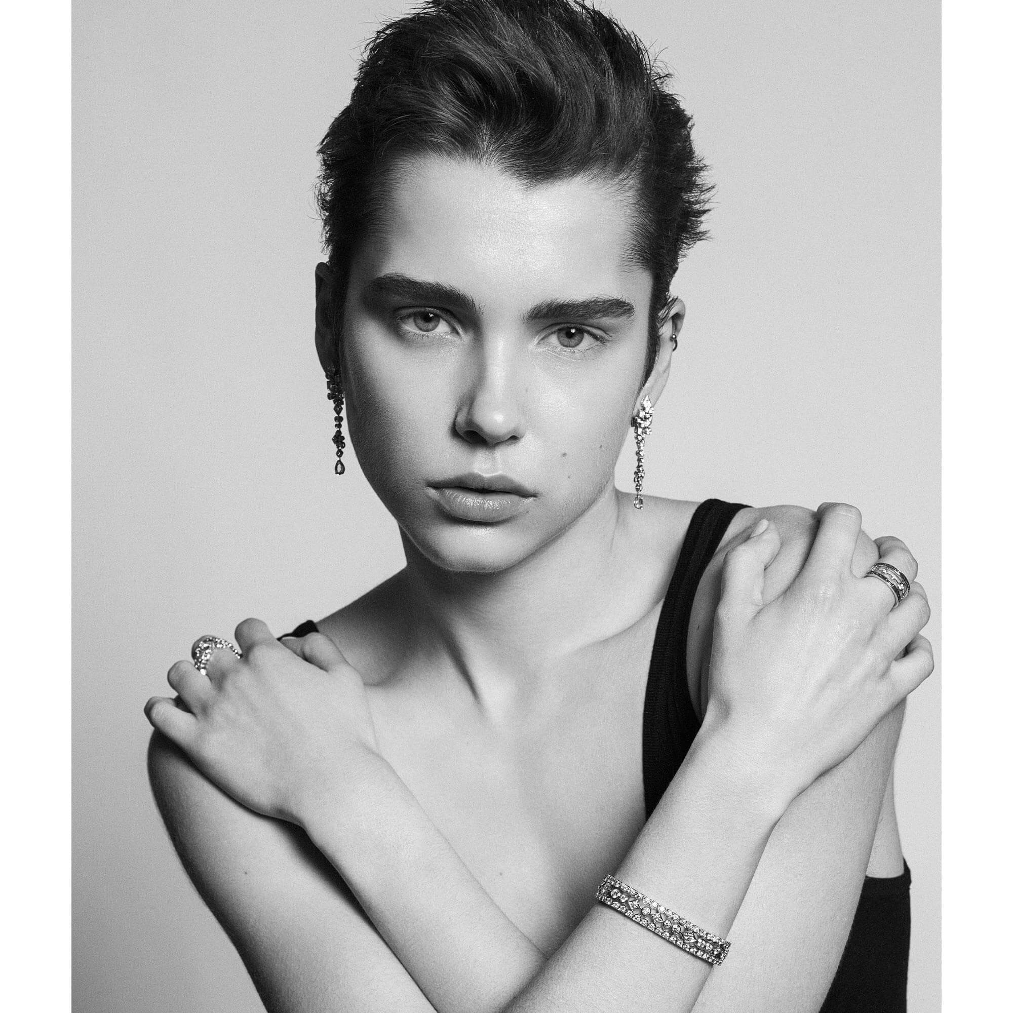 Model wears Garrard Albemarle Jewellery Collection earringsrings and bangle feature banner 3