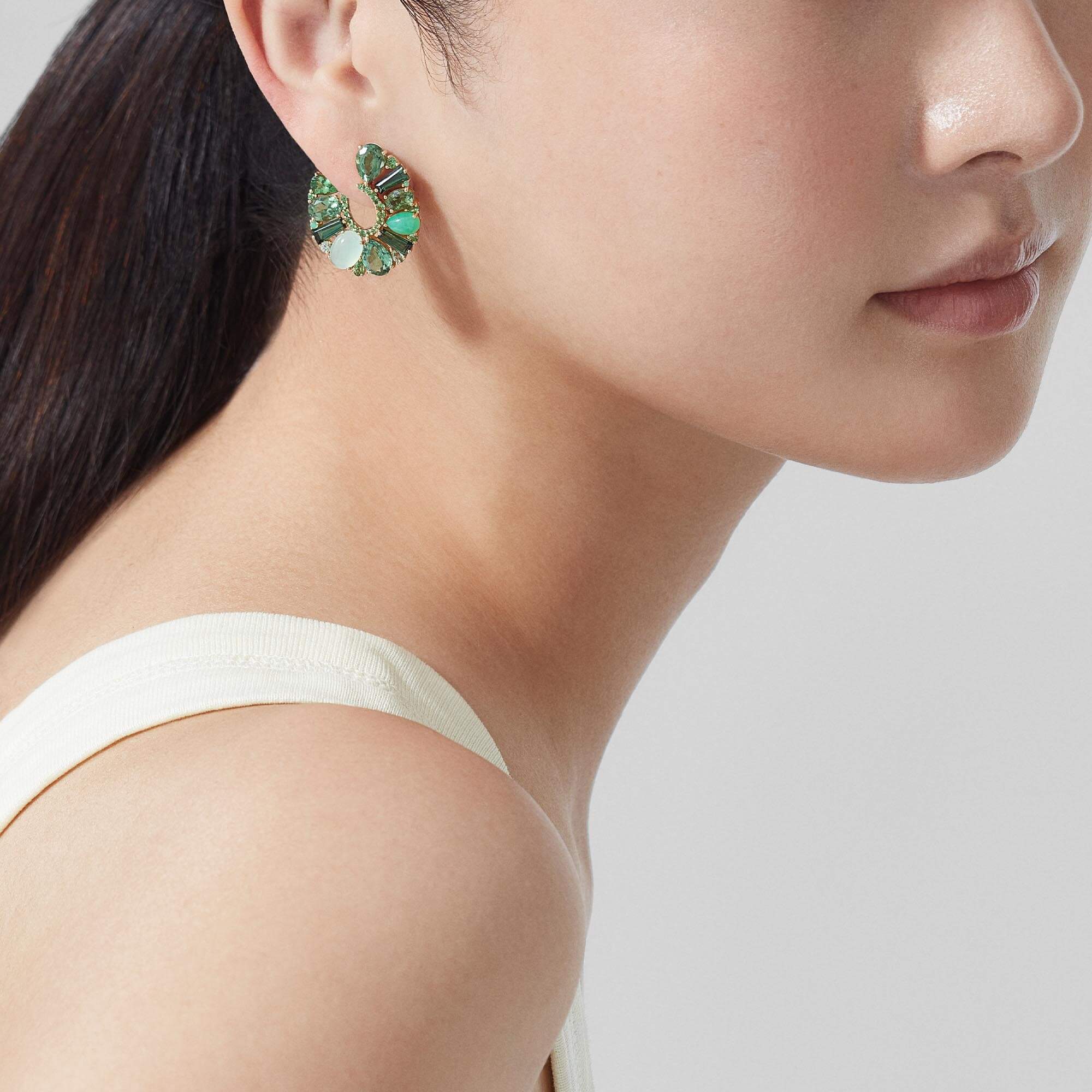 Garrard Blaze Jewellery Collection green sapphires, green tourmalines, tsavorites and chrysoprase hoop earrings in 18ct yellow gold, 2017666, Model