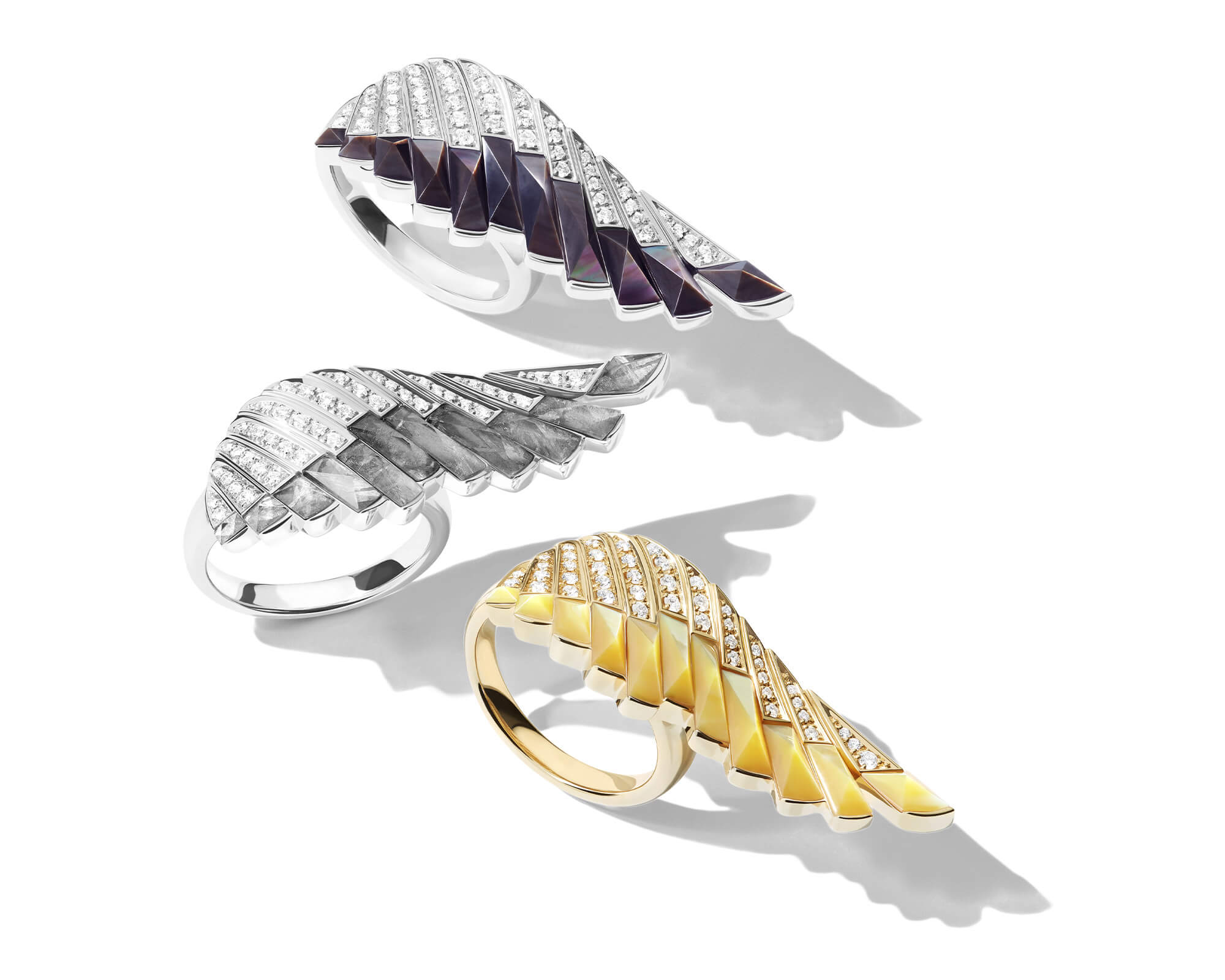 A trio of three Garrard Wings Rising collection rings