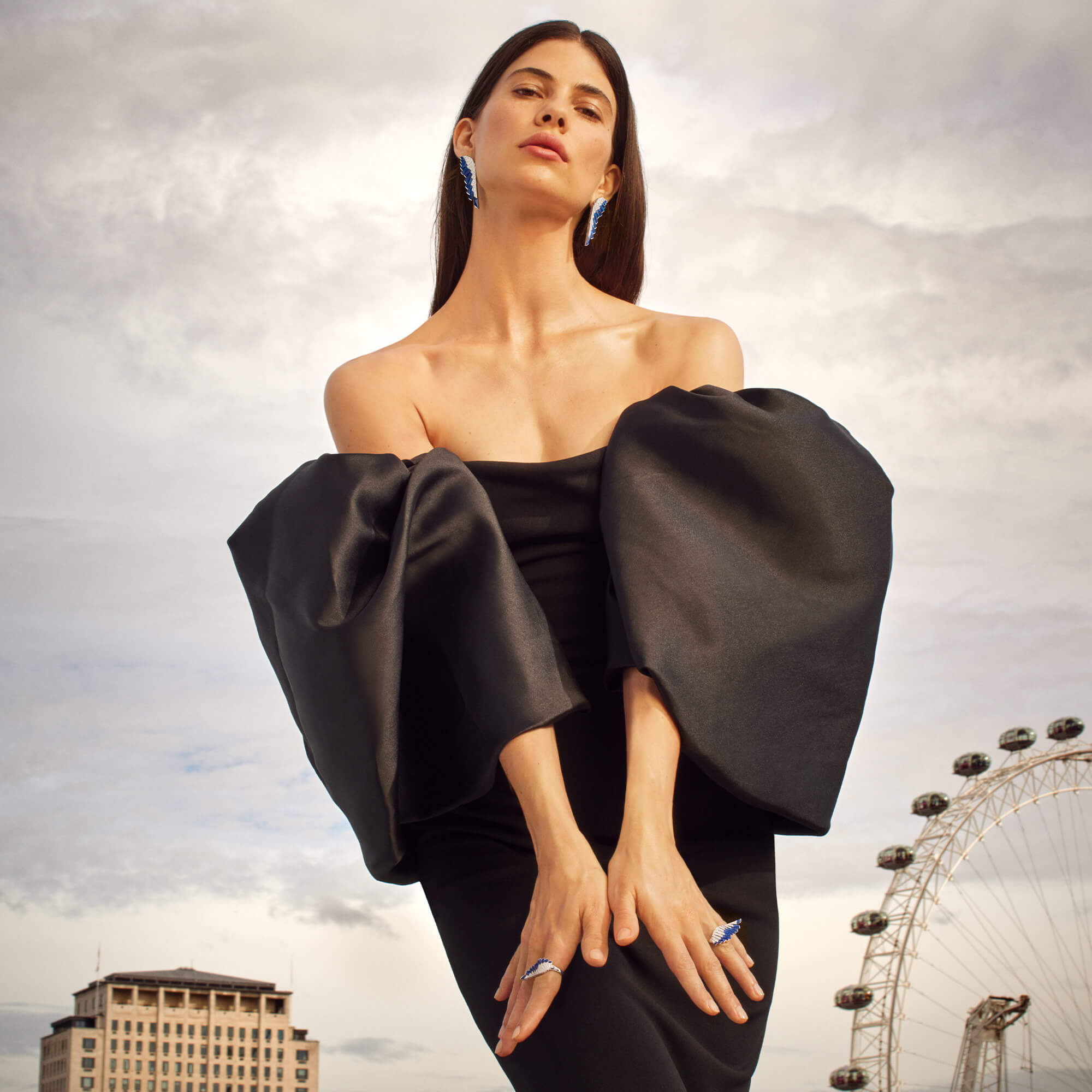 Model wears Garrard brand new Wings Rising collection jewellery with London skyline in the background