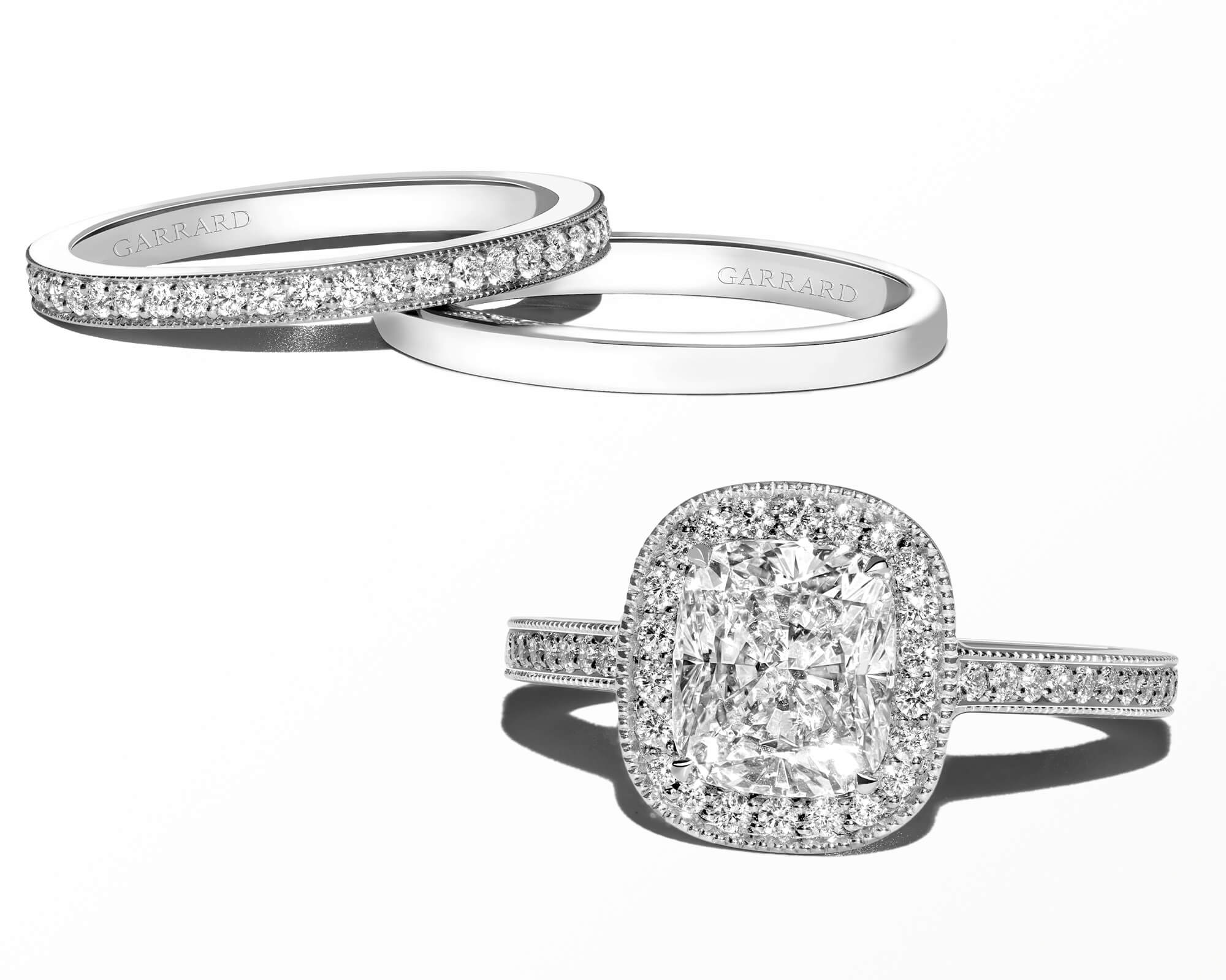 Garrard Evermore diamond engagement ring with an Evermore eternity ring and a plain wedding band